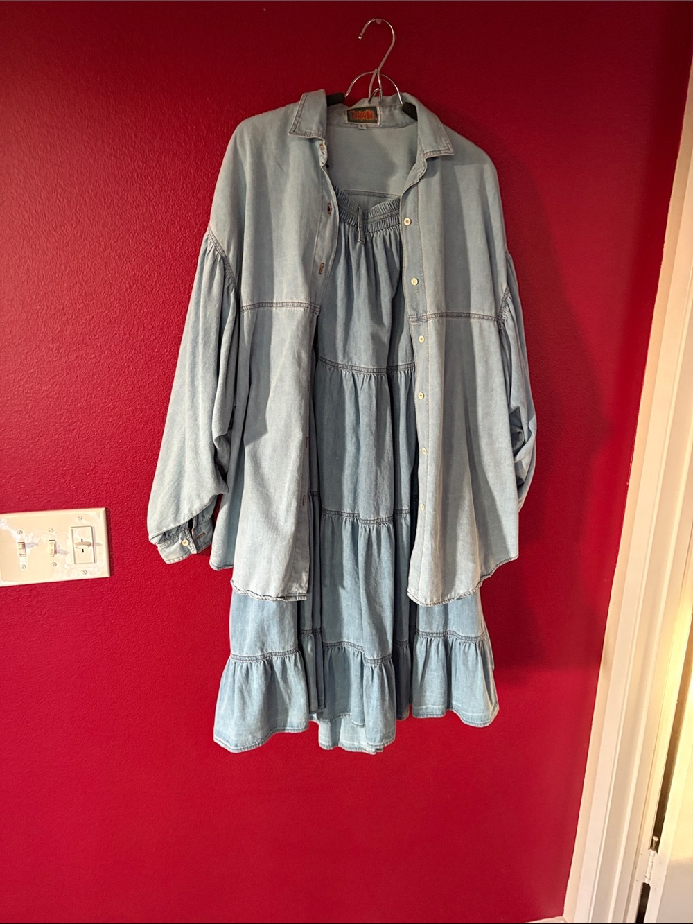 Light Blue denim skirt and top. Skirt is layered. Top is button down front.
